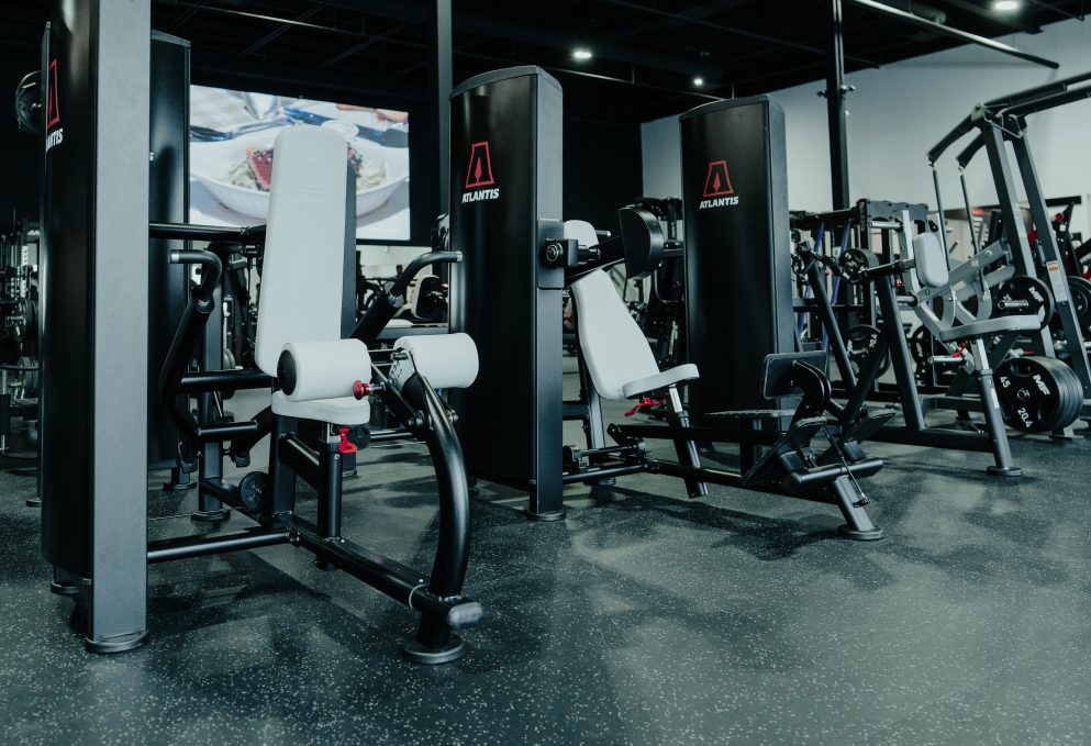 Gym owner reviewing commercial gym equipment financing options